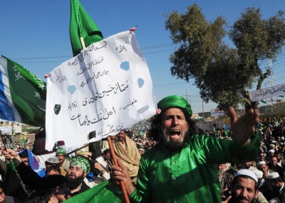 Activists of the Pakistani fundamentalist Islamic party Jamaat-i-Islami shout slogans calling for an en end to American drone attacks in tribal areas on January 23, 2011 during an anti-US protest rally in Peshawar. (A Majeed /AFP/Getty Images) 