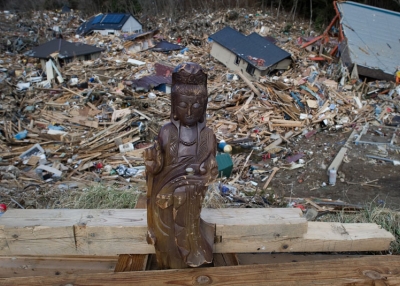 A religious statue stands among the rubble in Kesennuma, Miyagi prefecture on March 17, 2011 after the March 11 earthquake and tsunami. (NICOLAS ASFOURI/AFP/Getty Images)