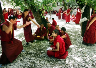 Monks take part in a daily debate at the Sera Monastery on July 4, 2006 in Lhasa, Tibetan Autonomous Region, China. (China Photos /Getty Images) 