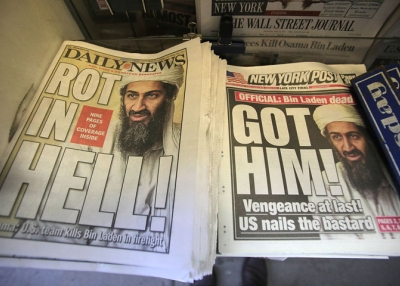 Newspapers announcing the death of accused 9-11 mastermind Osama bin Laden are seen at a newsstand outside the World Trade Center site May 2, 2011 in New York City. (Mario Tama/Getty Images)