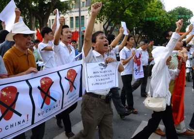 Vietnamese protesters shout anti-China slogans at a rally in central Hanoi on Aug. 14, 2011. About 100 people took to Hanoi's streets to protest against Beijing's territorial ambitions in the South China Sea. (Hoang Dinh Nam/AFP/Getty Images)