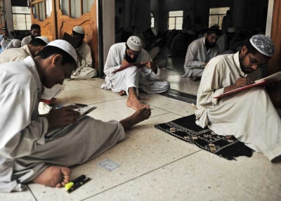 Pakistani and foreign religious students taking an exam at the Jamia Binoria madrasa in Karachi in 2009. (Rizwan Tabassum/AFP/Getty Images) 