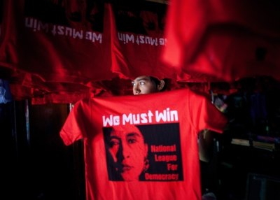 A Burmese worker hangs up freshly silkscreened National League for Democracy party (NLD) tshirt ahead of the parliamentary elections March 26, 2012 in Yangon, Myanmar. (Paula Bronstein/Getty Images)
