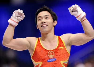 Chinese gymnast Zou Kai, recent victim of a real estate scam, celebrates after a performance at the World Gymnastics Championships in Tokyo on October 16, 2011. (Kazuhiro Nogi/AFP/Getty Images)