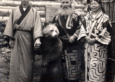 Japanese tourist with two Ainu in Hokkaido, date unknown. (Sgt. Steiner/Flickr)