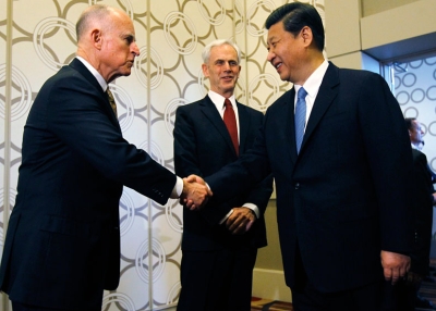 Chinese Vice President Xi Jinping (R) is greeted by CA Governor Jerry Brown (L) as Commerce Secretary John Bryson (C) looks on before speaking at the US-China Economy and Trade Cooperation Forum on Feb. 17, 2012 in Los Angeles. (Pool/Getty Images) 