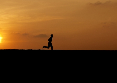 A young man takes off running as the sun sets over Galle Forte in Southern Sri Lanka on January 9, 2012. (Photosightfaces/Flickr)