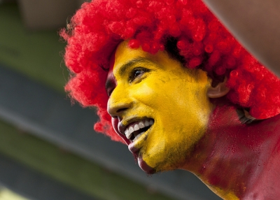 A dedicated fan cheers on the Sri Lankan cricket team in full hair and body paint in Colombo on September 18, 2012. (Photosightfaces/Flickr)