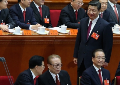 Chinese Vice President Xi Jinping walks past Chinese President Hu Jintao (front left), former Chinese President Jiang Zemin (front right) and Chinese Prime Minister Wen Jiabao (front right) during the opening session of the 18th Communist Party Congress held at the Great Hall of the People on November 8, 2012 in Beijing, China. (Photo by Feng Li/Getty Images)