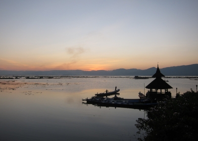 Boats docked during sunset on Inle Lake in Myanmar on December 13, 2012. (isriya/Flickr)