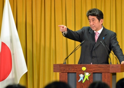 Incoming Japanese prime minister Shinzo Abe points to a journalist during a press conference at the LDP headquarters in Tokyo on December 17, 2012. (Yoshikazu Tsuno/AFP/Getty Images)