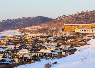 Snow covers the mountains and houses of Pyongyang, North Korea on January 14, 2013. (julianacunha/Flickr)
