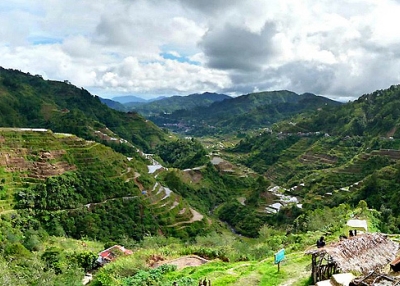 Clouds blanket vibrant green mountainsides in Ifugao, Philippines on February 18, 2013. (aileron/Flickr)