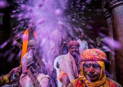 People celebrate Holi with colored powders at the Banke Bihari temple in Vrindavan, India on March 26, 2013. (Daniel Berehulak/Getty Images)