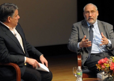 Joseph Stiglitz (R) onstage with William D. Cohan (L) at Asia Society New York on April 9, 2013. 