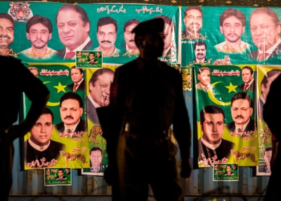 Punjab police wait for the arrival of Nawaz Sharif, leader of the Pakistan Muslim League-N (PML) party, during the final day of campaigning at an election rally in Lahore, Pakistan on May 09, 2013. (Daniel Berehulak/Getty Images)