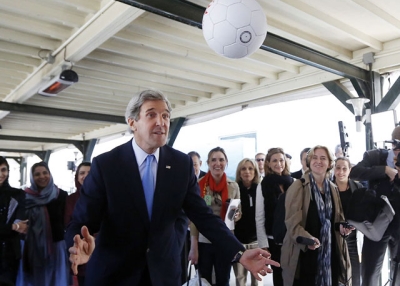 U.S. Secretary of State John Kerry heads an Afghan-made soccer ball toward the unseen captain of the Afghanistan's women's national soccer team in Kabul on March 26, 2013. (Jason Reed/AFP/Getty Images) 
