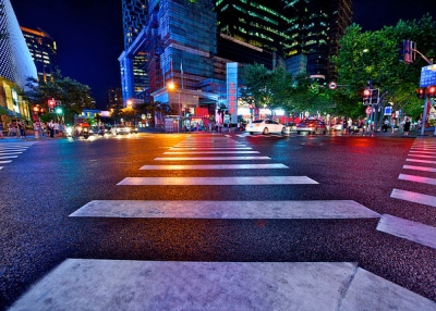 Paths cross at a glitzy intersection in Shanghai, China on August 20, 2013. (SimonQ/Flickr)