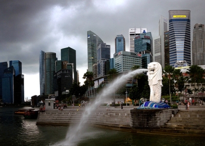 The Merlion is a mythical creature with the head of a lion and the body of a fish. Set against Singapore's skyline, the Merlion statue spouts water on November 14, 2013. (Gaelen/Flickr)