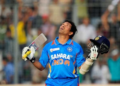 Tendulkar reacts after scoring his hundred century during the one-day international (ODI) Asia Cup cricket match between India and Bangladesh in Dhaka on March 16, 2012. (Munir uz Zaman/AFP/Getty Images)