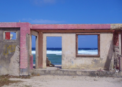 The empty door and window frames give a glimpse of high tide in the Marshall Islands on November 7, 2013. (AusAID/Flickr)