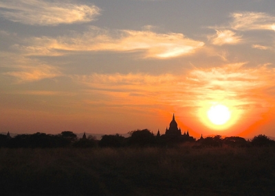 A setting sun casts an orange glow across the sky in Myanmar on January 28, 2014. (brentolson/Flickr)