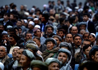 Afghan men fill a local hall as they listen to a presidential candidate during his last speech of the campaign on April 2, 2014. (Wakil Kohsar/AFP/Getty Images)