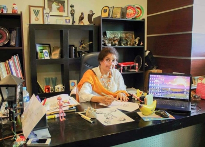 Shown here in her Islamabad office, Nigar Nazar is Pakistan's first professional female cartoonist, known to generations of readers as the creator of the iconic character "Gogi." (Gogi Studios)