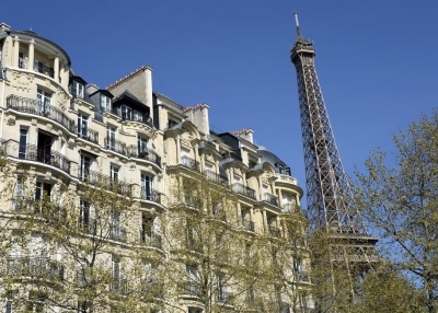 A Haussmannian-style building next to the Eiffel tower in Paris. (Bertrand Guay/Getty Images)