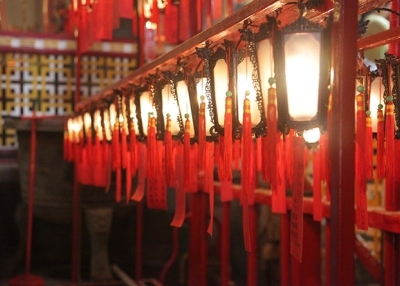 Red lanterns hanging in a row cast a golden glow inside Mo Man Temple in Hong Kong on November 15, 2015. (Tahiat Mahboob)