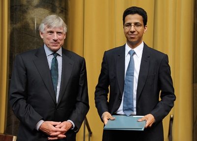 David Barboza (R) receives an award from Columbia University President Lee C. Bollinger at the annual Pulitzer Prizes in Journalism, Letters, Drama, and Music Winners Luncheon at Columbia University on May 30, 2013 in New York City. (Dave Kotinsky/Getty Images)