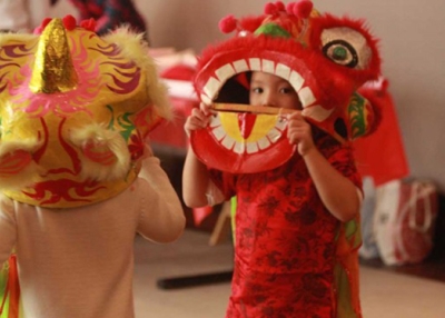 Children participate in traditional lion dancing during a past Lunar New Year celebration at Asia Society New York. (Jingyu Shi/Asia Society)