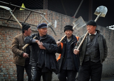 Chinese migrant workers leave their factory construction site for a lunch break in Beijing on March 16, 2012. (Mark Ralston/AFP/Getty Images) 