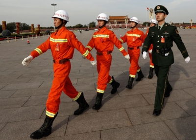 Chinese paramilitary policemen parade in front of Tiananmen Square on Nov. 7, 2012 in Beijing. The 18th National Congress of the Communist Party of China (CPC) convenes in Beijing on Nov. 8. (Lintao Zhang/Getty Images)