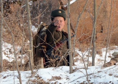 A North Korean soldier reacts as he patrols along the Yalu River, near the North Korean town of Sinuiju, after the country conducted its third nuclear test on February 12, 2013. (Mark Ralston/AFP/Getty Images)