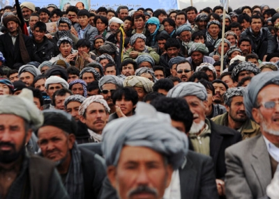 Afghan men crowd a field at a political rally during a campaign stop by presidential candidate Zalmai Rassoul in Bamiyan on April 1, 2014. (Hashmatullah/AFP/Getty Images)