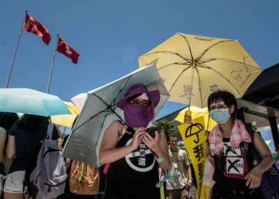 Hong Kong pro-democracy supporters stand outside the city's legislature after a vote in Hong Kong on June 18, 2015. (Philippe Lopez/AFP/Getty Images)