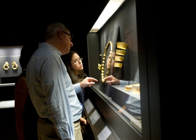 Visitors to Asia Society in New York inspect artifacts from the Philippine Gold: Treasures of Forgotten Kingdom exhibition. (Elena Olivo/Asia Society)
