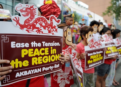 Activists wearing monkey masks display placards during a rally against Beijing's island-building in the South China Sea, ahead of the year of the monkey at the Chinese consulate in Manila on February 5, 2016. (Jay Directo/AFP/Getty Images)