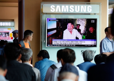 South Koreans watch TV news reporting the North Korea's nuclear test at the Seoul Railway Station. (Woohae Cho/Getty Images)