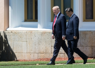 US President Donald Trump (L) and Chinese President Xi Jinping (R) walk together at the Mar-a-Lago estate in West Palm Beach, Florida, April 7, 2017. (Jim Watson/AFP/Getty Images)