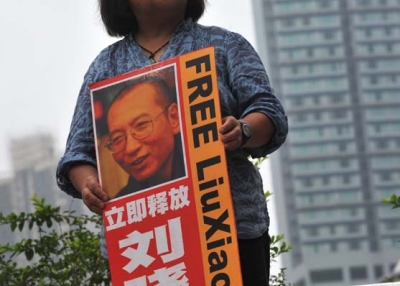 An activist holds a portrait of Liu Xiaobo in Hong Kong on May 13, 2010. (ANTONY DICKSON/AFP/Getty Images) 