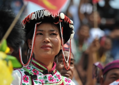 A Kachin tribe woman listens to Aung San Suu Kyi in the town of Moe Kaung on February 23, 2012. (Soe Than Win/Getty Images)