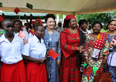 China's First Lady, Peng Liyuan (L), and her Tanzanian counterpart Salma Kikwete (R) on a joint visit to the Wanawake na Maendeleo Foundation (WAMA) offices in Dar Es Salaam, Tanzania, on March 25, 2013. (John Lukuwi/AFP/Getty Images) 