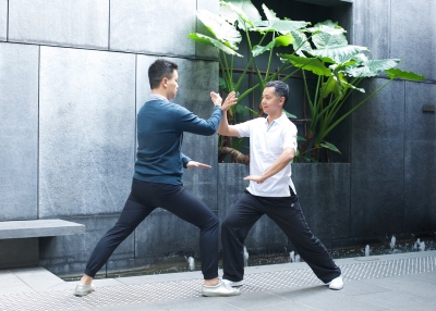 Master Bernard Kwan demonstrates with a member