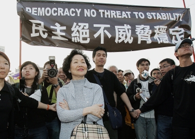 Anson Chan, joins a march by pro-democracy demonstrators in Hong Kong demanding the full democracy that was promised when Britain handed its colony back to China 
