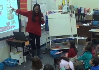 Chunman Xie teaches her students to identify foods.