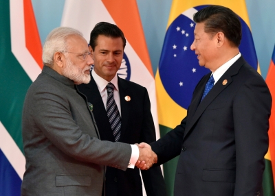 Narendra Modi greets Xi Jinping on the sidelines of a BRICS summit in 2017.