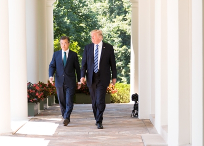 Presidents Moon Jae-in and Donald Trump walk together at the White House in June 2017