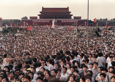 Thousands of people pour into Beijing's Tiananmen Square in the weeks before the June 4, 1989 massacre.